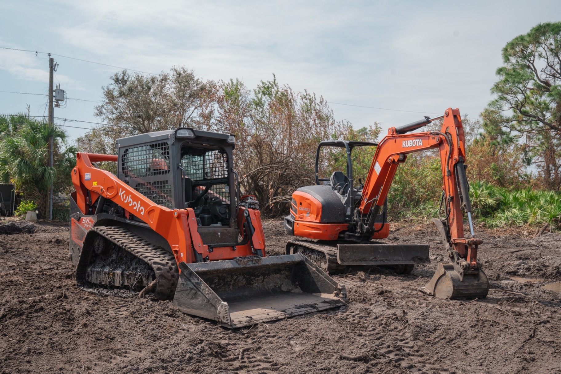 Kubota skid steer and mini excavator on site